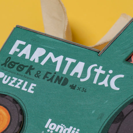 Londji Farmtastic Look & Find 36-piece puzzle box featuring tractor-shaped packaging and Anna Baquero illustrations.