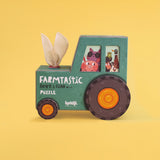 Londji Farmtastic look and find puzzle box shaped like a green tractor with animal illustrations on a yellow background.