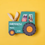 Londji Farmtastic Look & Find 36-piece puzzle in a tractor-shaped box with animal illustrations on a yellow background.