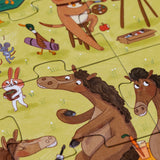 Close-up of Londji Farmtastic puzzle pieces showing illustrated horses, a rabbit, and a duck on a green field.