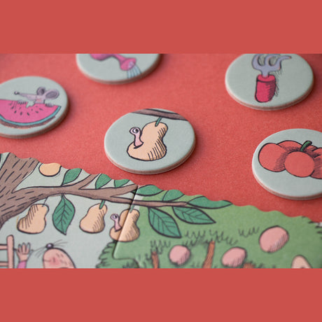 Illustrative garden puzzle pieces showing a worm in a pear, tomatoes, and garden tools on a red background.