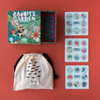 Londji Rabbit's Garden puzzle box with a canvas storage bag and three matching tiles featuring garden-themed illustrations.