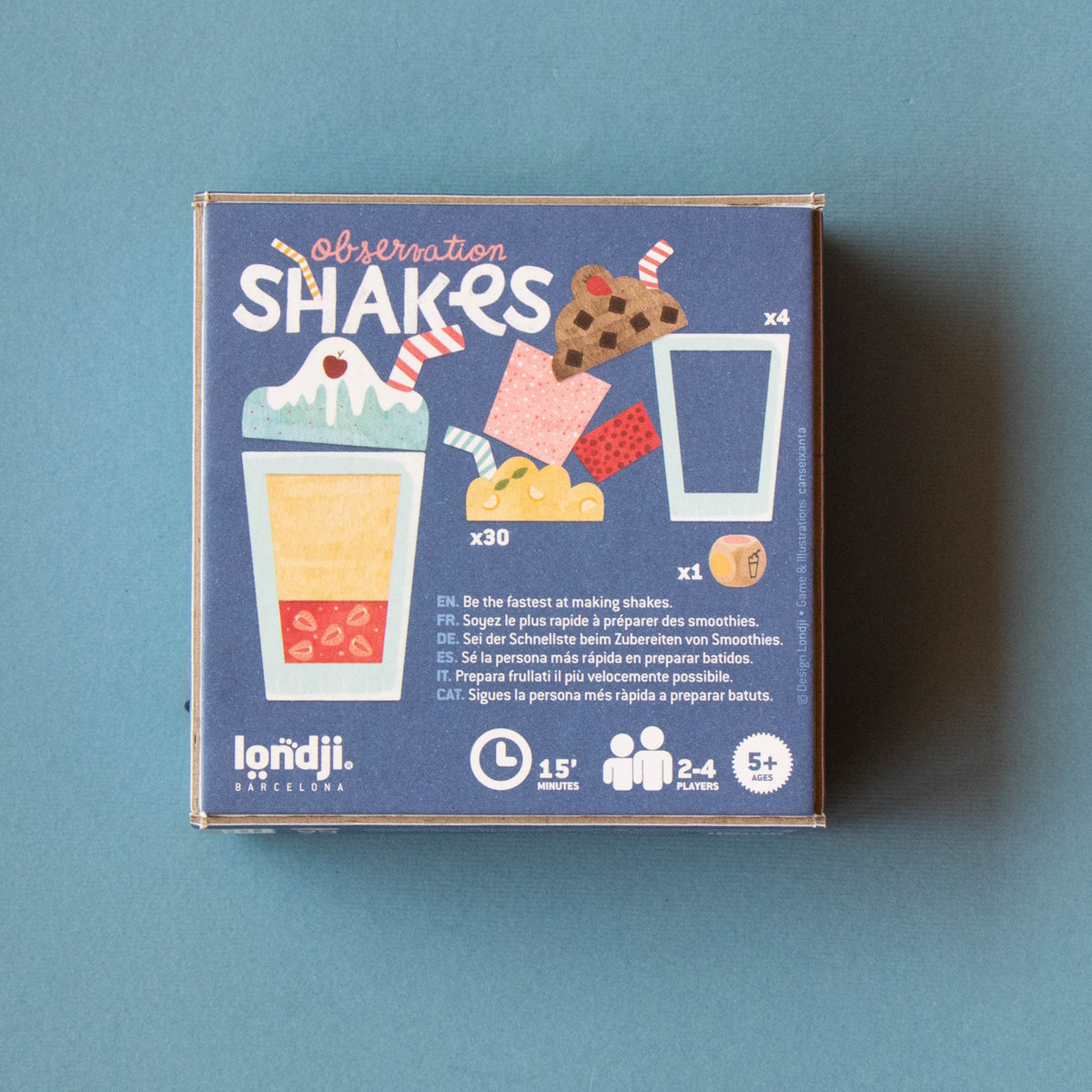 Londji Shakes observation board game box featuring colorful milkshake illustrations and gameplay details on a blue background.