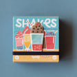 Londji Shakes Tiny Game observation card game box for ages 5 plus, featuring colorful milkshake illustrations.