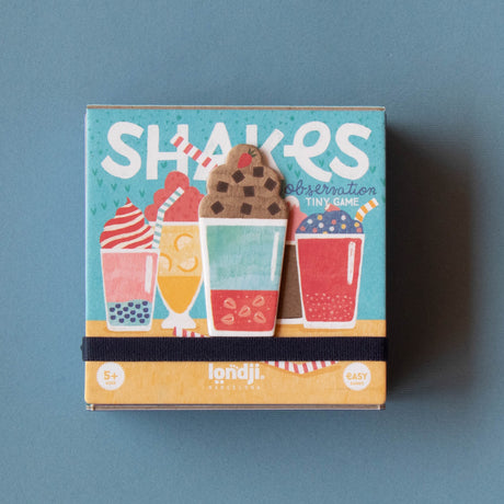 Londji Shakes Tiny Game observation card game box for ages 5 plus, featuring colorful milkshake illustrations.