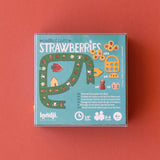 Londji Strawberries board game box showing game pieces, a green path board, and 2-4 player icons on a red background.