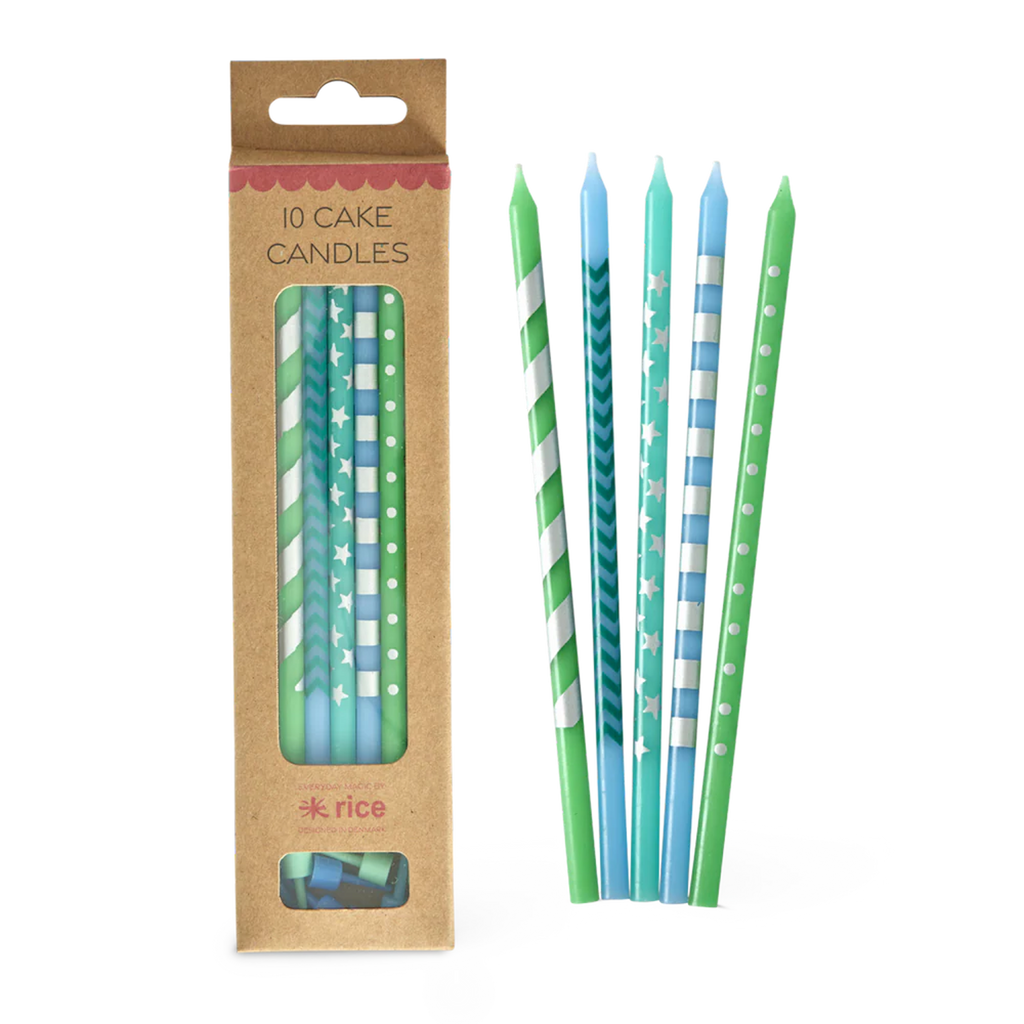 A set of ten cake candles in a brown cardboard box, featuring green and blue striped, dotted, and star patterns. Bright and celebratory design.