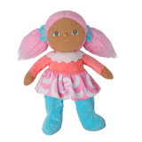 Standing plush doll with pink pigtails, a coral top, and a swirl skirt against a white background.