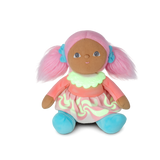 Plush doll with pink pigtails, a pastel dress, and blue shoes sitting against a white background.