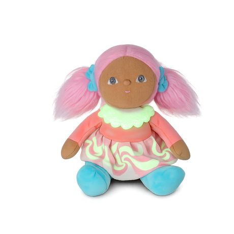 Plush doll with pink pigtails, a pastel dress, and blue shoes sitting against a white background.