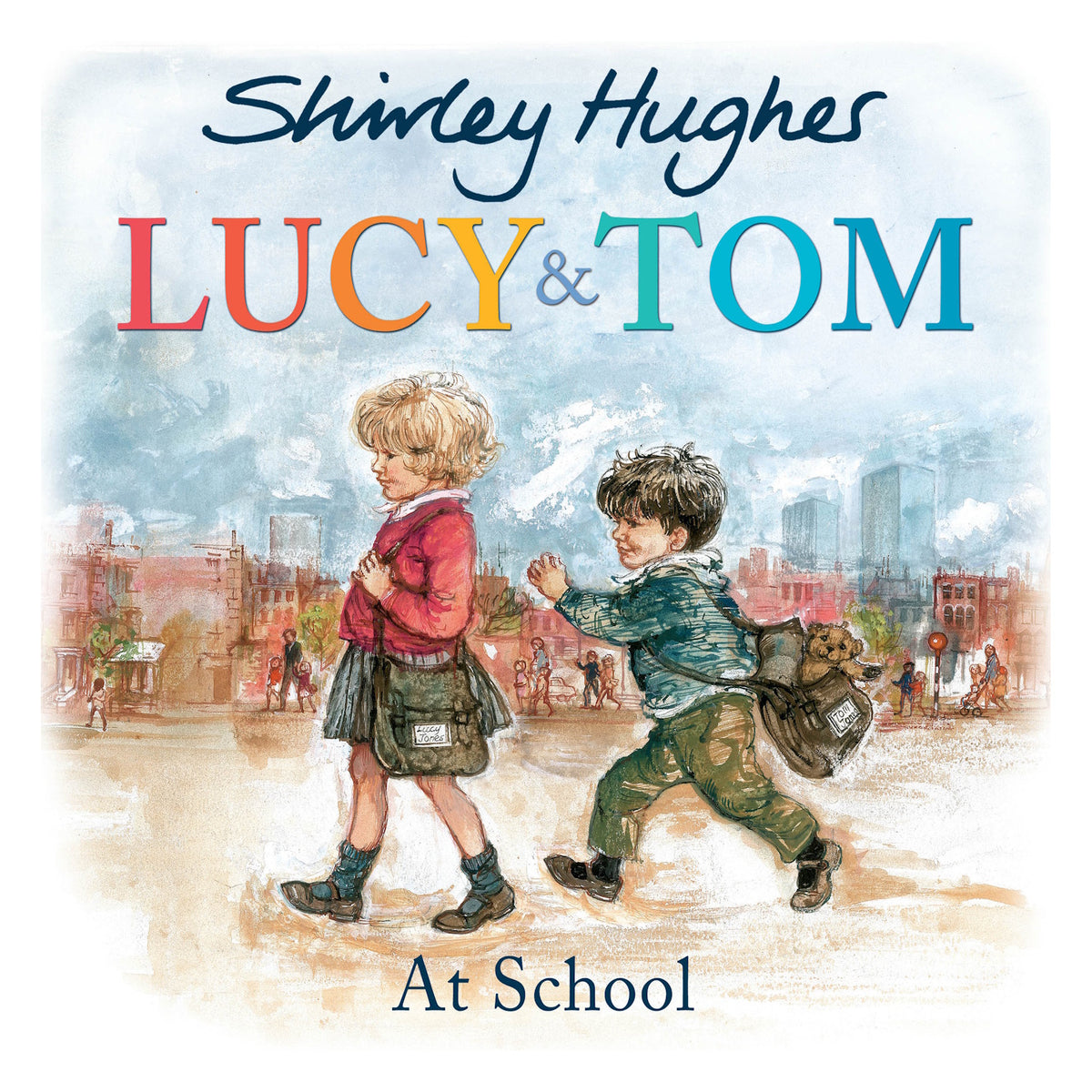 Book cover for 'Lucy & Tom At School' showing two young children walking together outdoors with school bags.