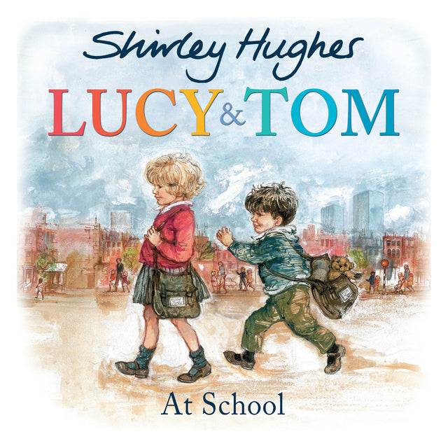 Book cover for 'Lucy & Tom At School' showing two young children walking together outdoors with school bags.