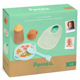 Djeco Pomea Doll Lunch Break feeding set with bib, magic bottle, bowl, and spoon in original packaging.