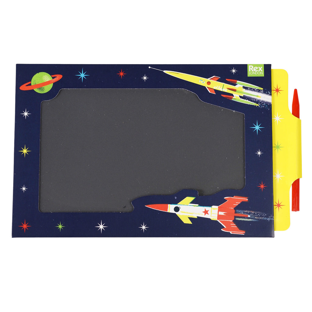 A colorful space-themed drawing board with a red pen, featuring rockets and stars on the border.