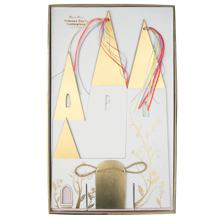 Packaged Meri Meri Princess Castle Centerpiece with gold foil turrets and colorful ribbon streamers.
