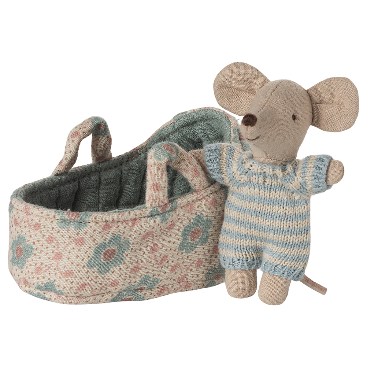 A stuffed toy mouse wearing a blue striped outfit stands beside a small floral-patterned fabric cradle, conveying a playful and cozy atmosphere.