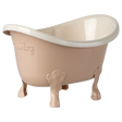 Small beige ceramic bathtub with clawfoot legs and embossed text on the side, set against a white background. The tub has a glossy finish.