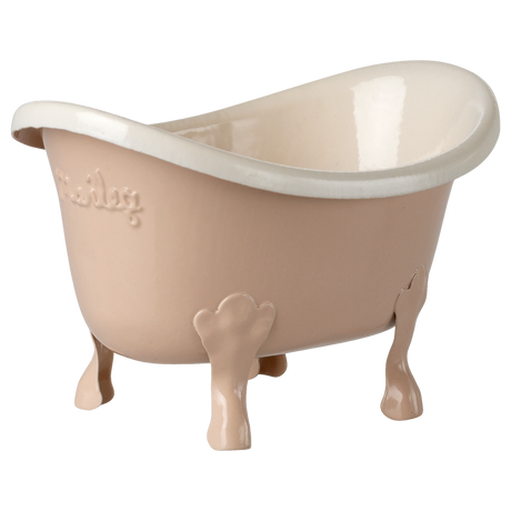 Small beige ceramic bathtub with clawfoot legs and embossed text on the side, set against a white background. The tub has a glossy finish.