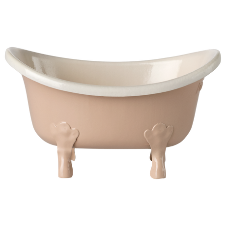 Elegant, vintage-style clawfoot miniature bathtub in pale pink with white interior, set against a white background, conveying a sense of classic charm.