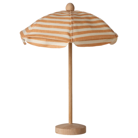 Wooden model of a striped beach umbrella with beige and white fabric on a simple pole, set against a white background, evoking a playful summer vibe.