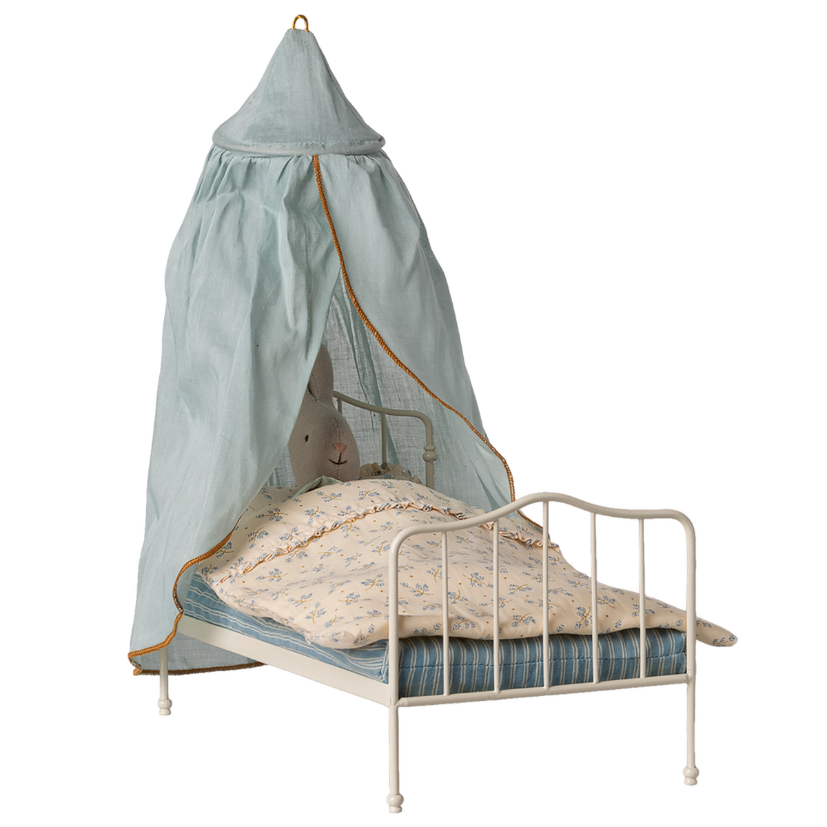 A small white metal bed with a stuffed rabbit under a floral blanket, covered by a light blue canopy with an orange trim, against a white background.