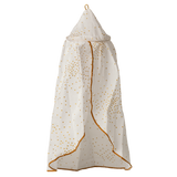 A white fabric canopy with gold polka dots hangs against a white background. It has a conical top, and gold trim outlining its edges.