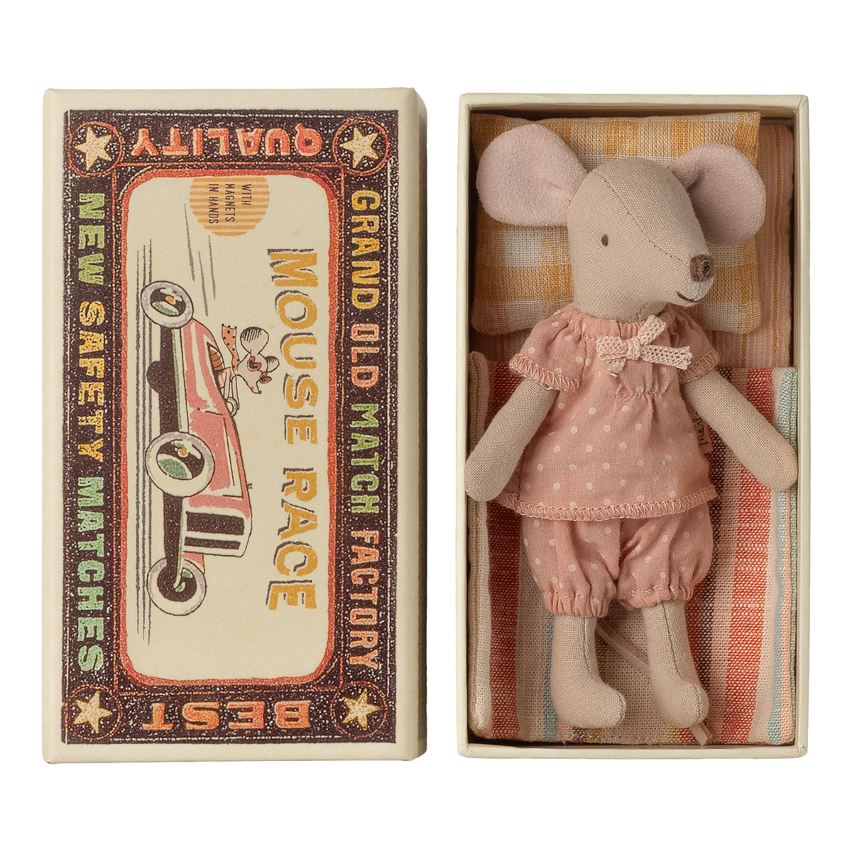 Cute toy mouse in pink polka-dot outfit lies in a small open box resembling a vintage matchbox labeled "Mouse Race," next to colorful bedding.