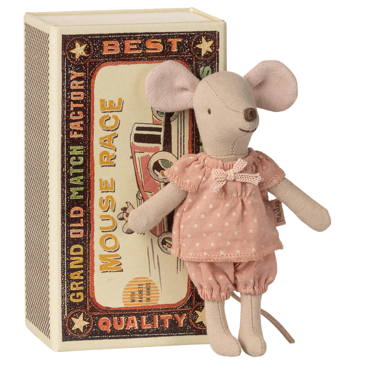 A plush toy mouse in a pink, polka-dotted dress stands against a vintage-style matchbox with a "Mouse Race" design. The toy and box evoke a charming, nostalgic feel.