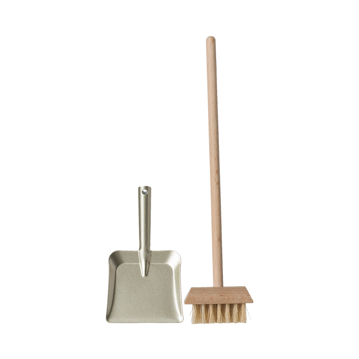 A miniature dustpan with a metal finish and a wooden-handled broom with natural bristles are placed upright on a plain background, evoking simplicity and cleanliness.