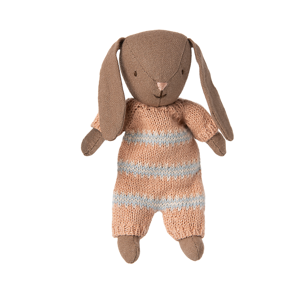 A soft, brown fabric bunny doll with long ears, wearing a knitted, peach and blue striped outfit. It appears cute and cuddly, conveying warmth.