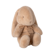 A plush tan bunny with floppy ears and a delicate bow around its neck sits against a plain background, conveying a gentle and cozy vibe.