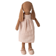 Stuffed rabbit toy with long ears, wearing a light pink dress and floral-patterned shoes, set against a white background, conveying a vintage charm.