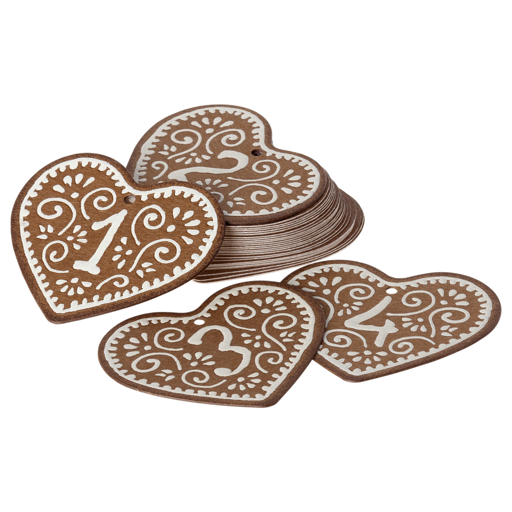 Heart-shaped wooden tags with numbers 1 to 4 lie against a white background. Each tag features intricate white designs, conveying elegance and craft.