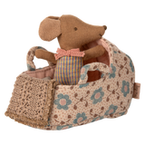 A miniature fabric carry cot with a floral rose print, complete with a soft baby mouse doll in a pink knitted outfit—ideal for imaginative play, dollhouse collections, and Maileg fans.