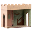 Miniature cardboard dollhouse room with a castle exterior, intricate wallpaper, staircase mural, and chandelier. Arched doorways add an elegant touch.