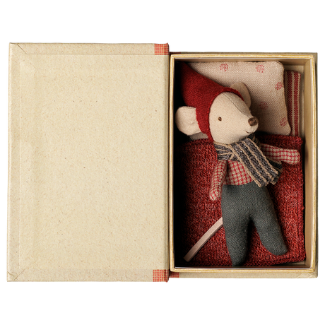 Maileg Christmas mouse toy sleeping in an open book-shaped box with bedding.