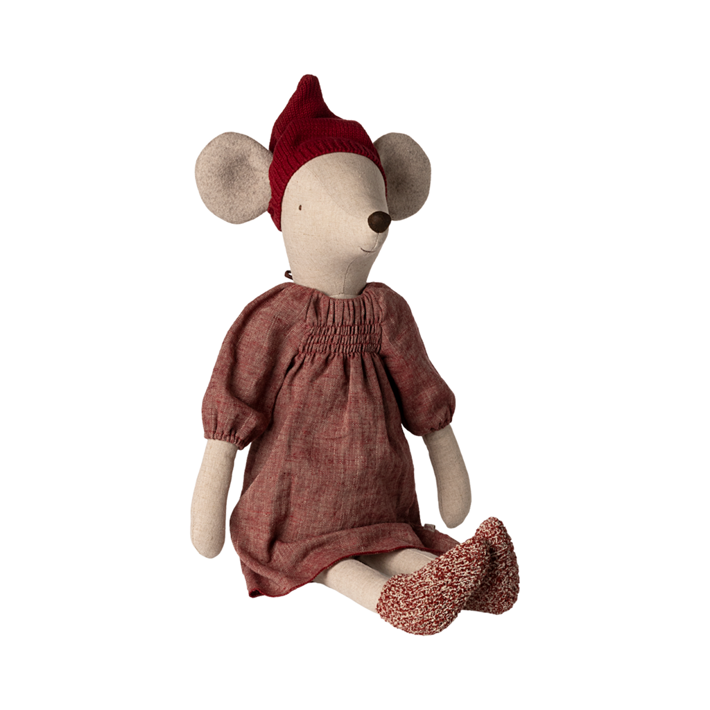 A soft, stuffed mouse doll wearing a red knit hat and a cozy pink dress, sitting with a gentle expression.