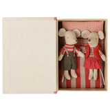 Maileg Christmas twin mice little brother and sister in holiday outfits tucked inside an open book box.