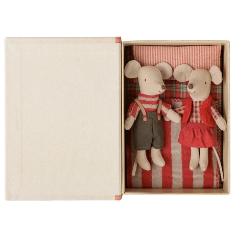 Maileg Christmas twin mice little brother and sister in holiday outfits tucked inside an open book box.
