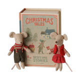 Maileg Christmas twin mice, little brother and sister, standing next to a bedtime stories book box.