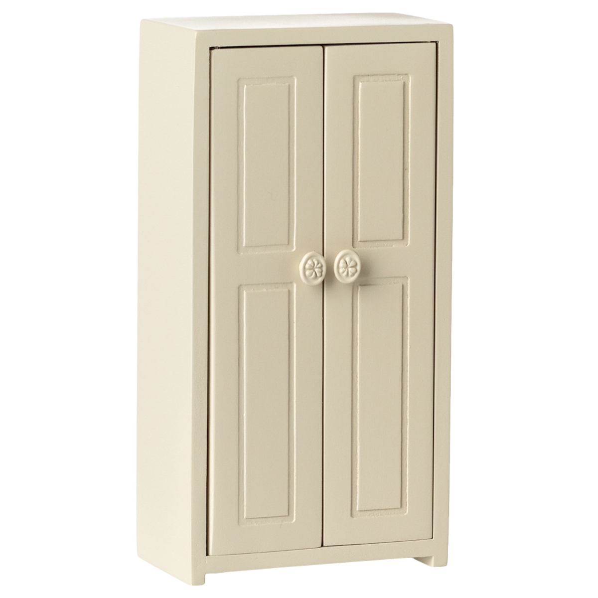 A small cream-colored cupboard with two panelled doors, each featuring a round flower-patterned knob, set against a plain white background.