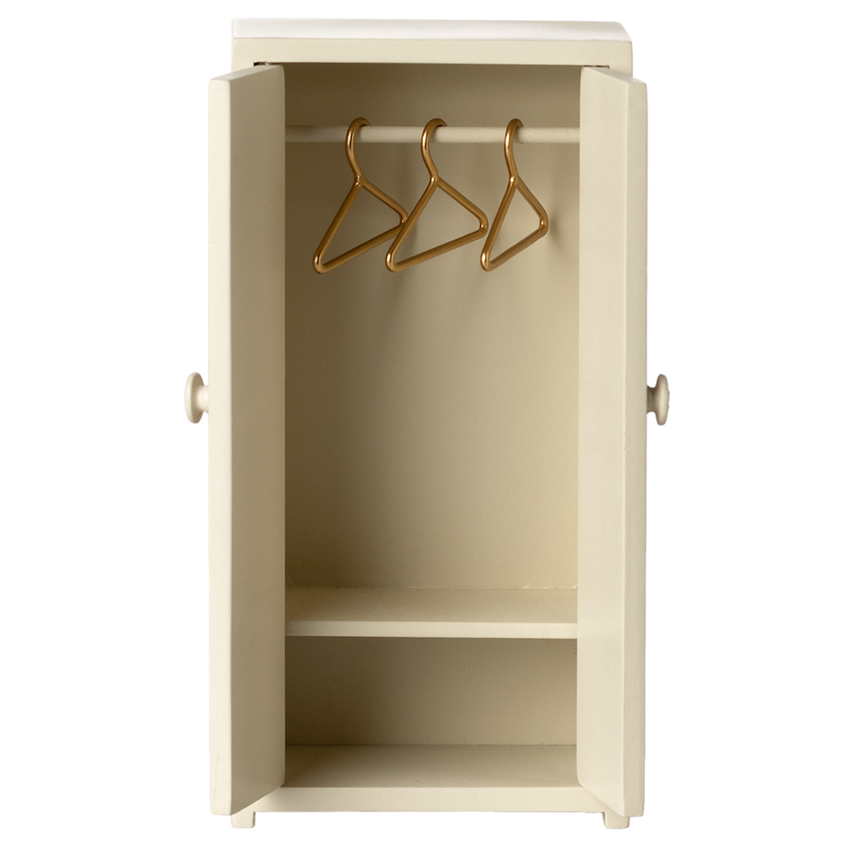 Cream-colored mini wardrobe with open doors, revealing three gold hangers on a rod and a single shelf below. It conveys simplicity and tidiness.