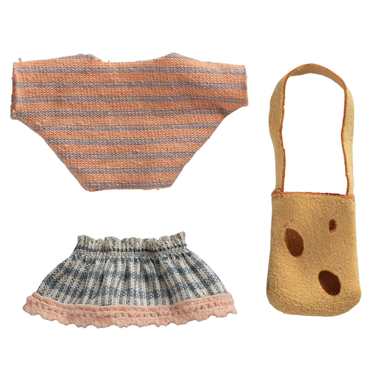 Knitted doll clothes set on black background; includes a peach-striped top, blue patterned skirt with pink trim, and tan shoulder bag with brown spots.