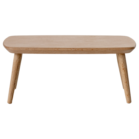 Miniature light wooden coffee table with a smooth, rounded top and tapered legs, adding a minimalist touch to any space.