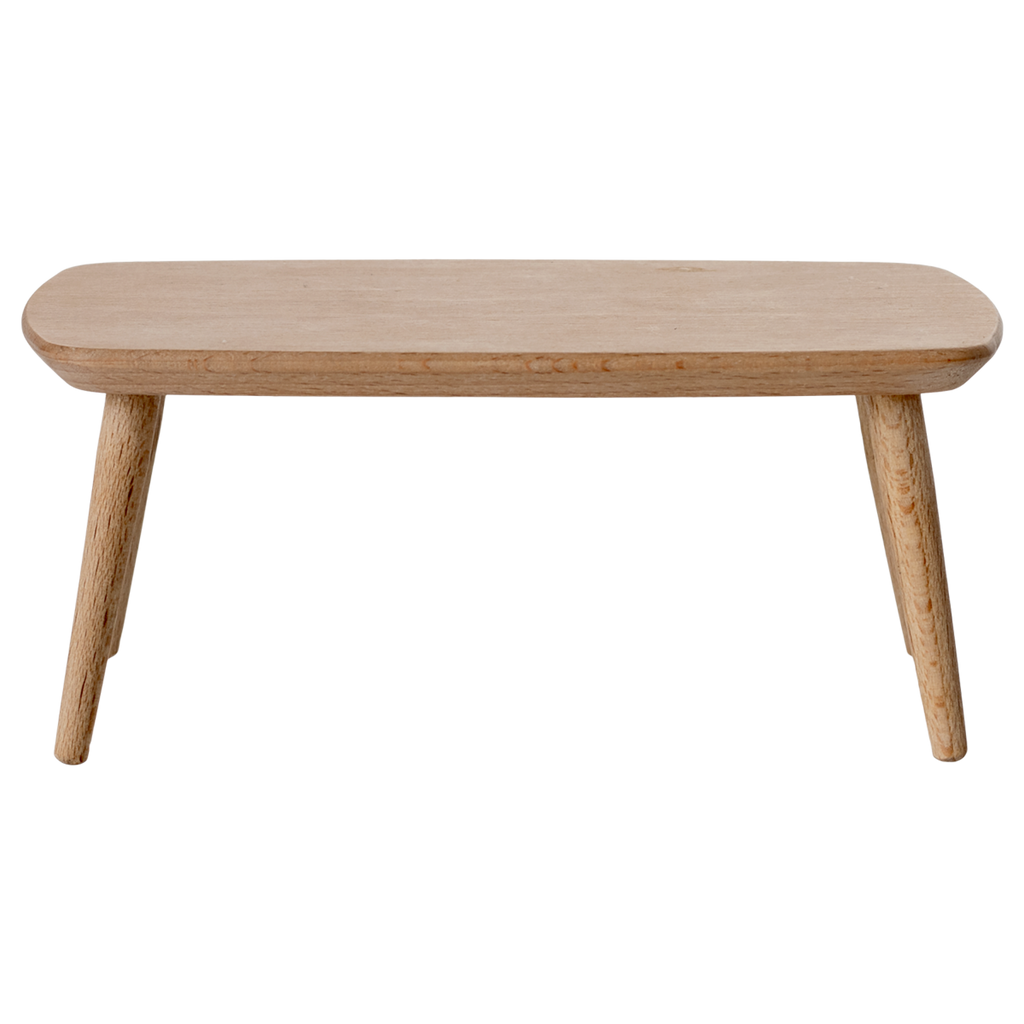Miniature light wooden coffee table with a smooth, rounded top and tapered legs, adding a minimalist touch to any space.