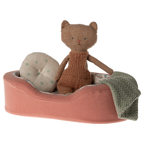The image shows a soft toy dogs bed in coral, with a pillow and blanket on a white background.