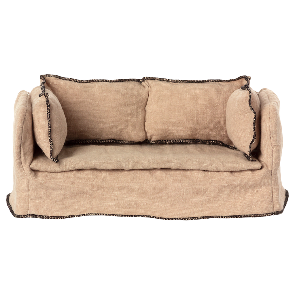 Beige fabric dollhouse sofa with three cushioned backrests, trimmed in dark stitching. The cozy design suggests a miniature living room setting.