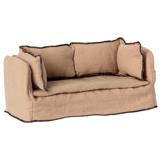 Beige fabric dollhouse sofa with three cushioned backrests, trimmed in dark stitching. The cozy design suggests a miniature living room setting.