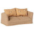 A vintage-style miniature sofa with a beige and brown checkered pattern. It features two floral-patterned cushions, conveying a cozy and nostalgic vibe.