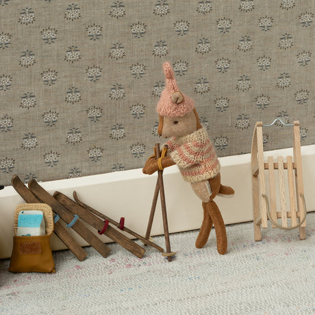Maileg Little Sister Deer winter toy with miniature wooden skis and sled.